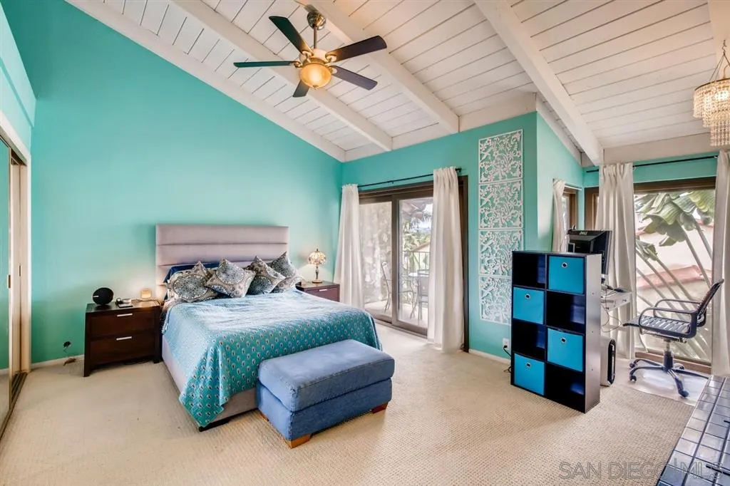1913 Alga Road Carlsbad, CA 92009 - Photo 12 of 25 a bedroom with a bed ceiling fan and a window