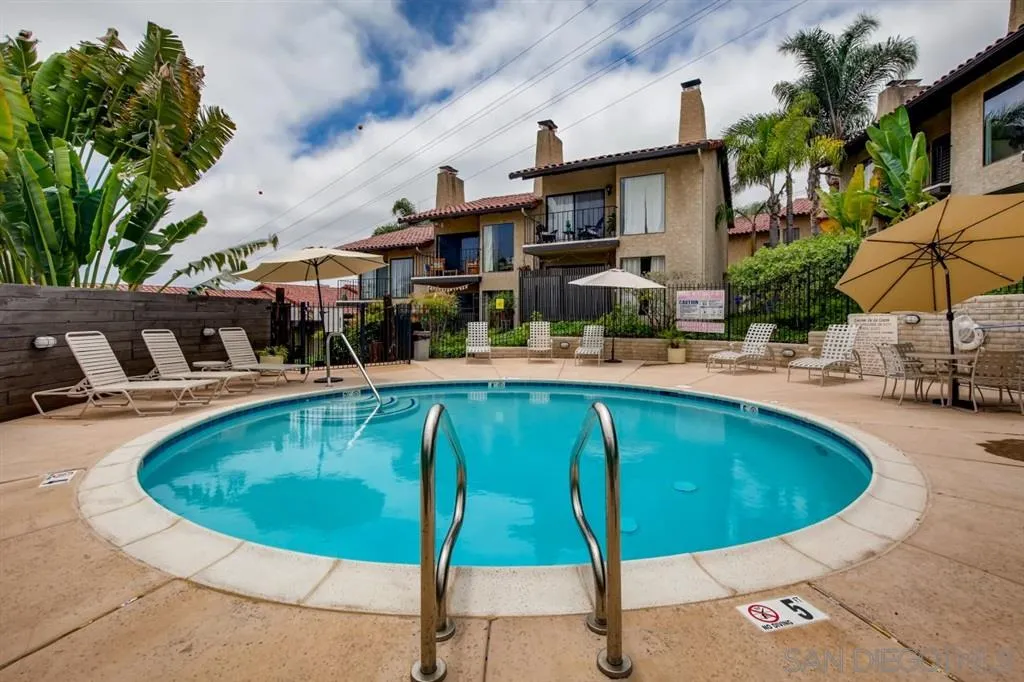 1913 Alga Road Carlsbad, CA 92009 - Photo 21 of 25 a swimming pool with outdoor seating and yard