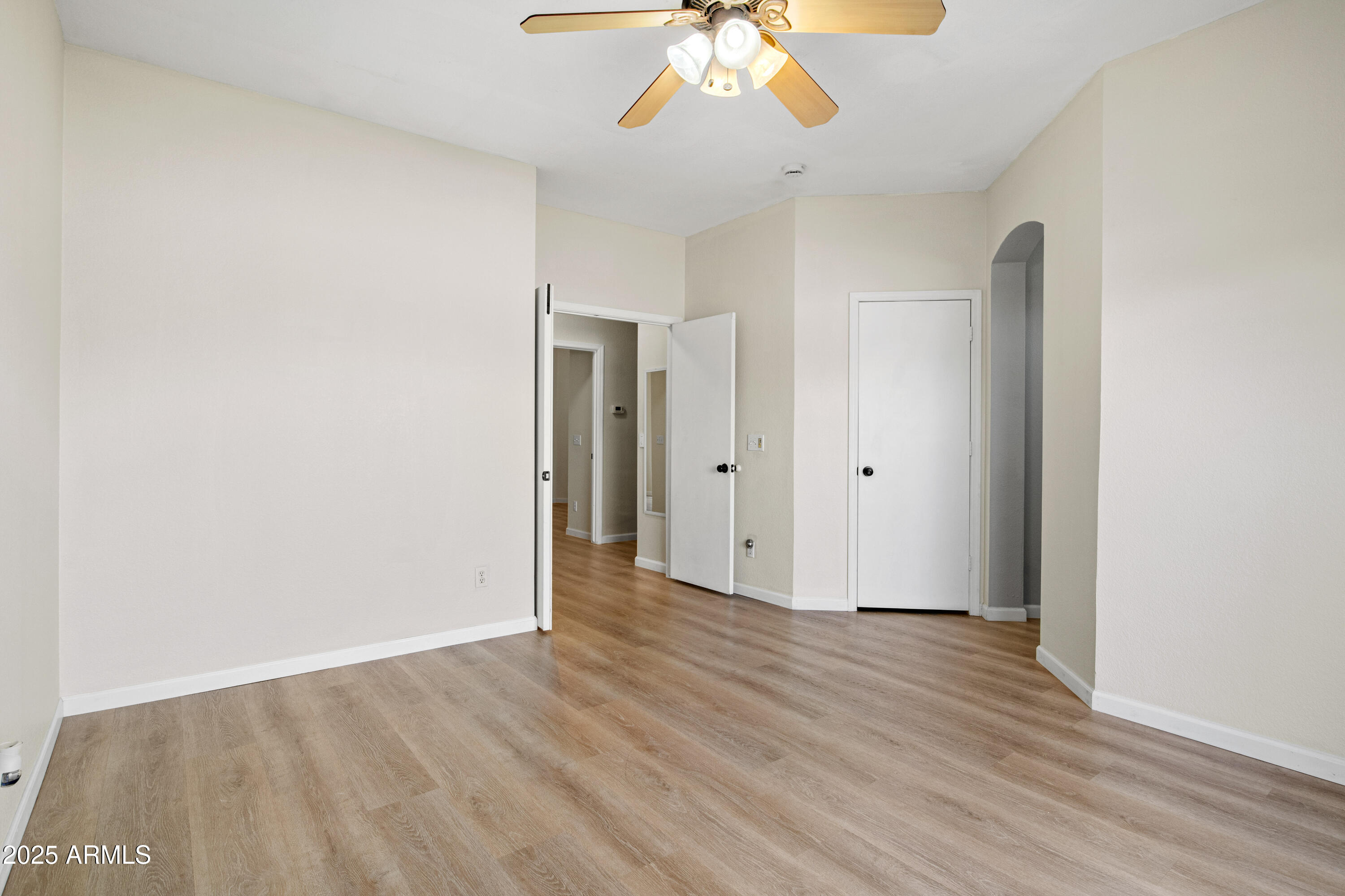 625 North Hamilton Street, Unit 41 Chandler, AZ 85225 - Photo 15 of 36 a view of an empty room with wooden floor