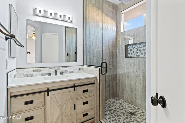 a bathroom with a sink and a mirror