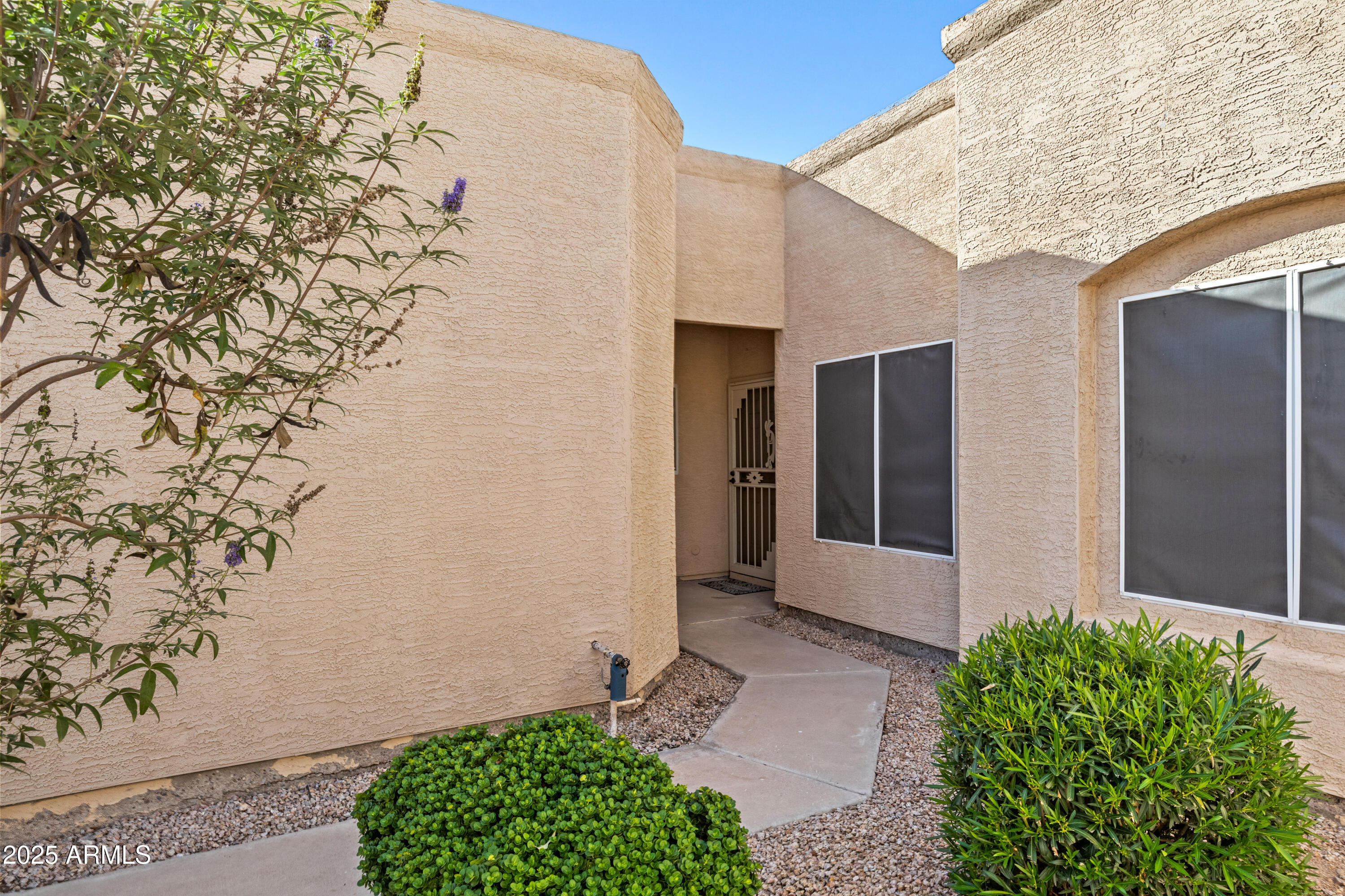 625 North Hamilton Street, Unit 41 Chandler, AZ 85225 - Photo 2 of 36 a front view of a house with a yard