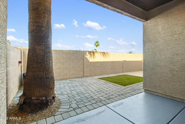 a view of a livingroom with a window and wooden floor