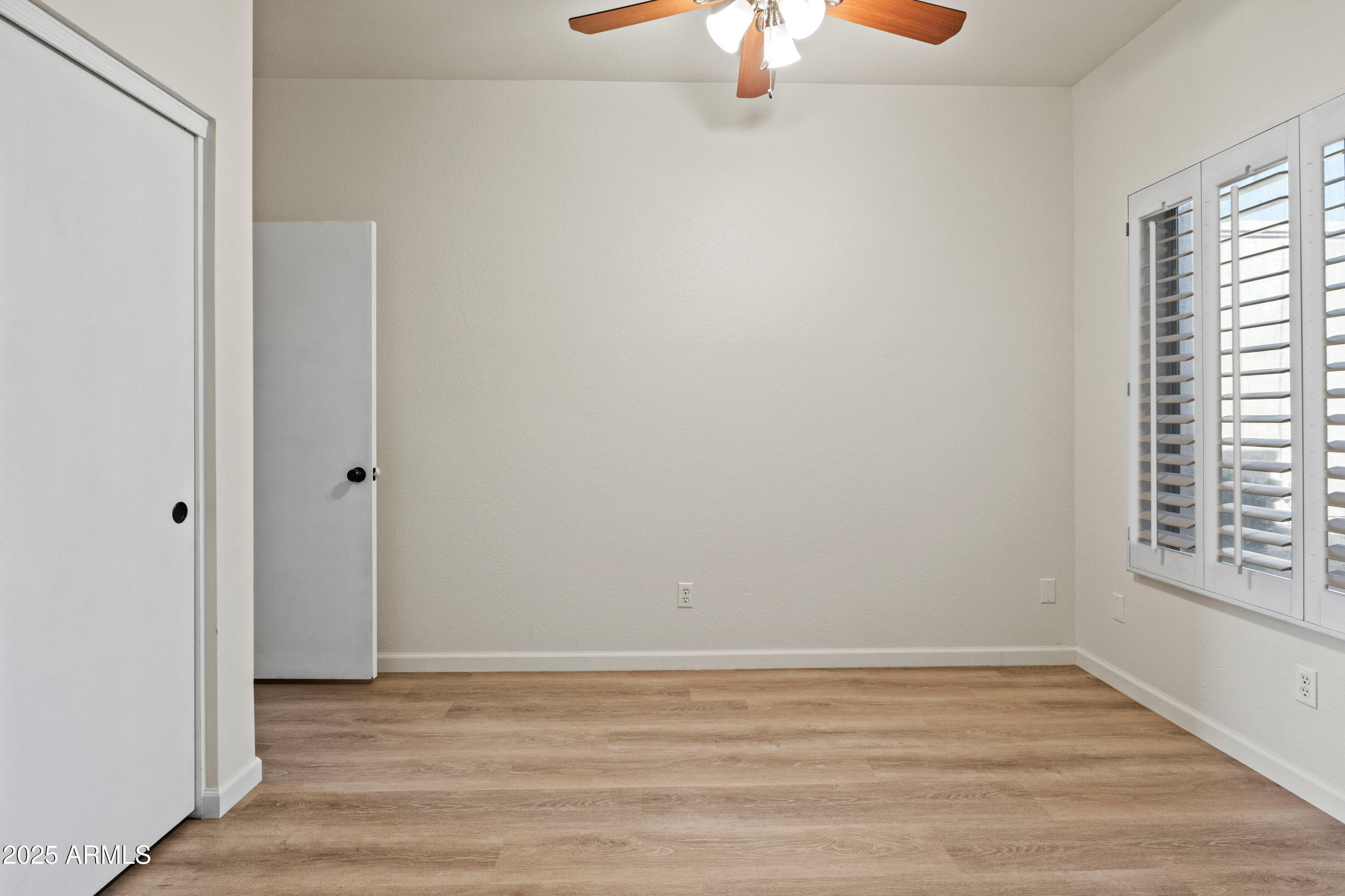 625 North Hamilton Street, Unit 41 Chandler, AZ 85225 - Photo 25 of 36 a view of an empty room with wooden floor and a window