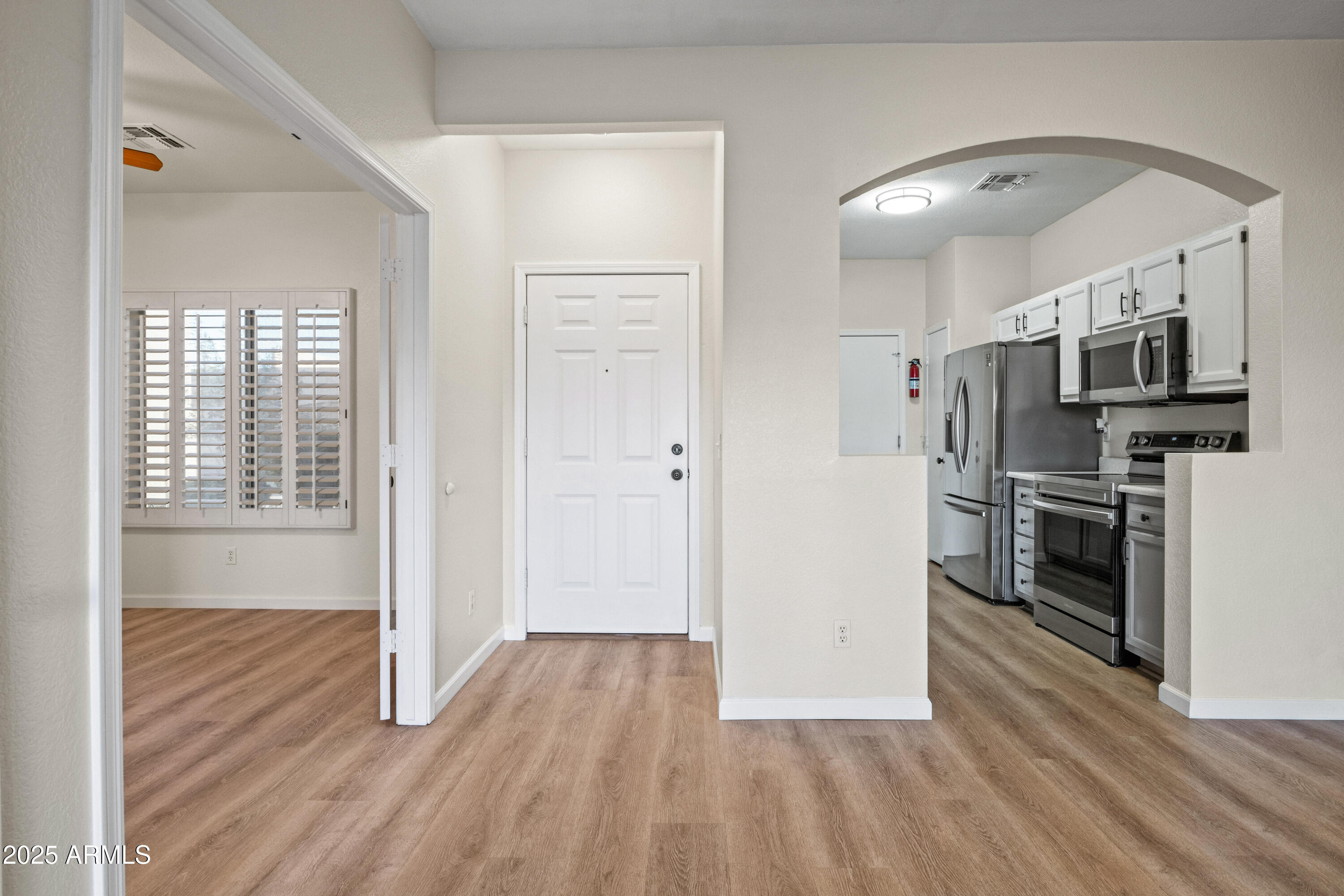 625 North Hamilton Street, Unit 41 Chandler, AZ 85225 - Photo 4 of 36 a view of a kitchen with a stove cabinets and wooden floor