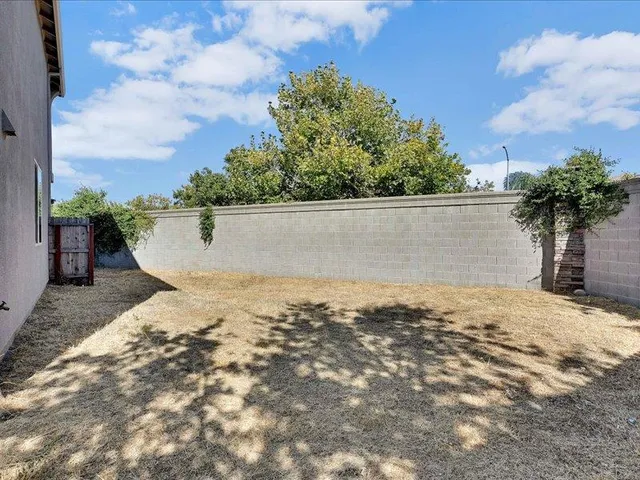 a view of a swimming pool with a yard