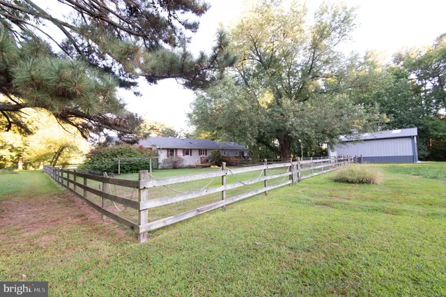 a view of balcony with wooden floor and outdoor seating