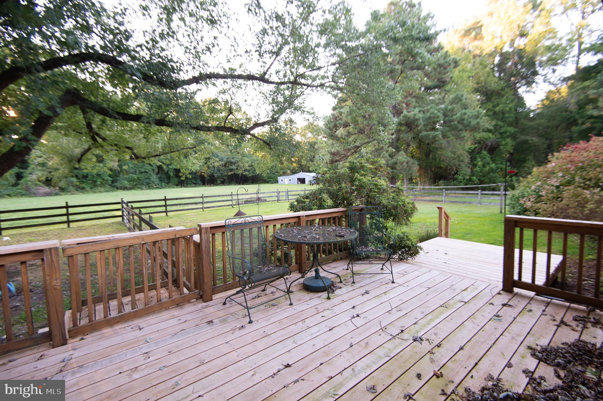 11482 Kittys Corner Road Cordova, MD 21625 - Photo 15 of 68 a view of a deck with chairs and wooden floor