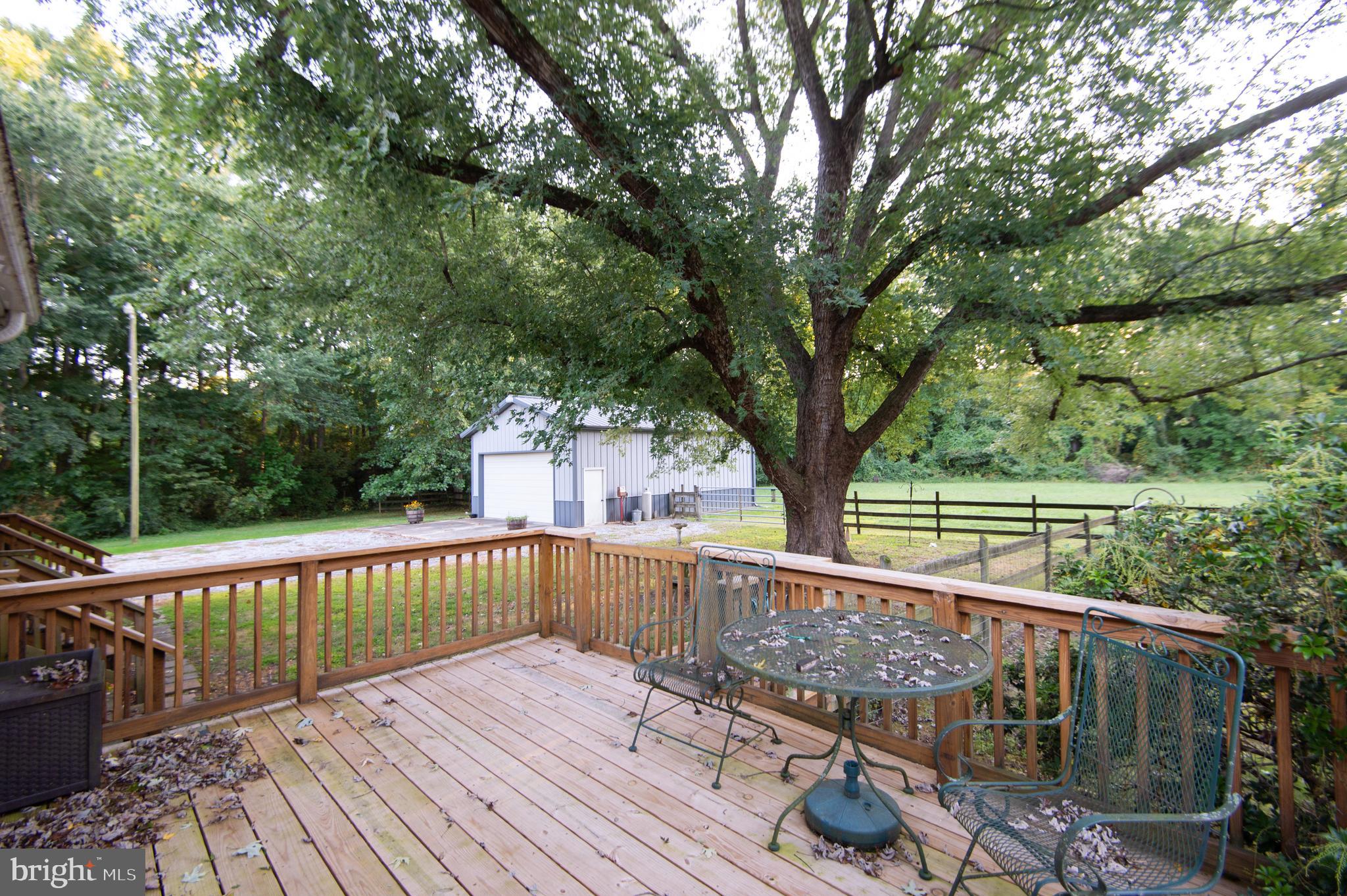 11482 Kittys Corner Road Cordova, MD 21625 - Photo 16 of 68 a view of balcony with wooden floor and outdoor seating