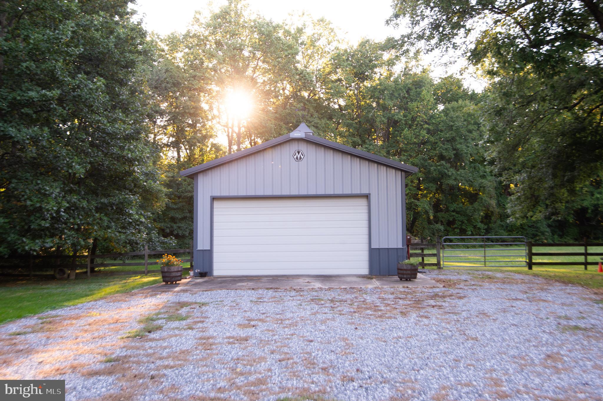11482 Kittys Corner Road Cordova, MD 21625 - Photo 17 of 68 a view of backyard with large trees and wooden fence