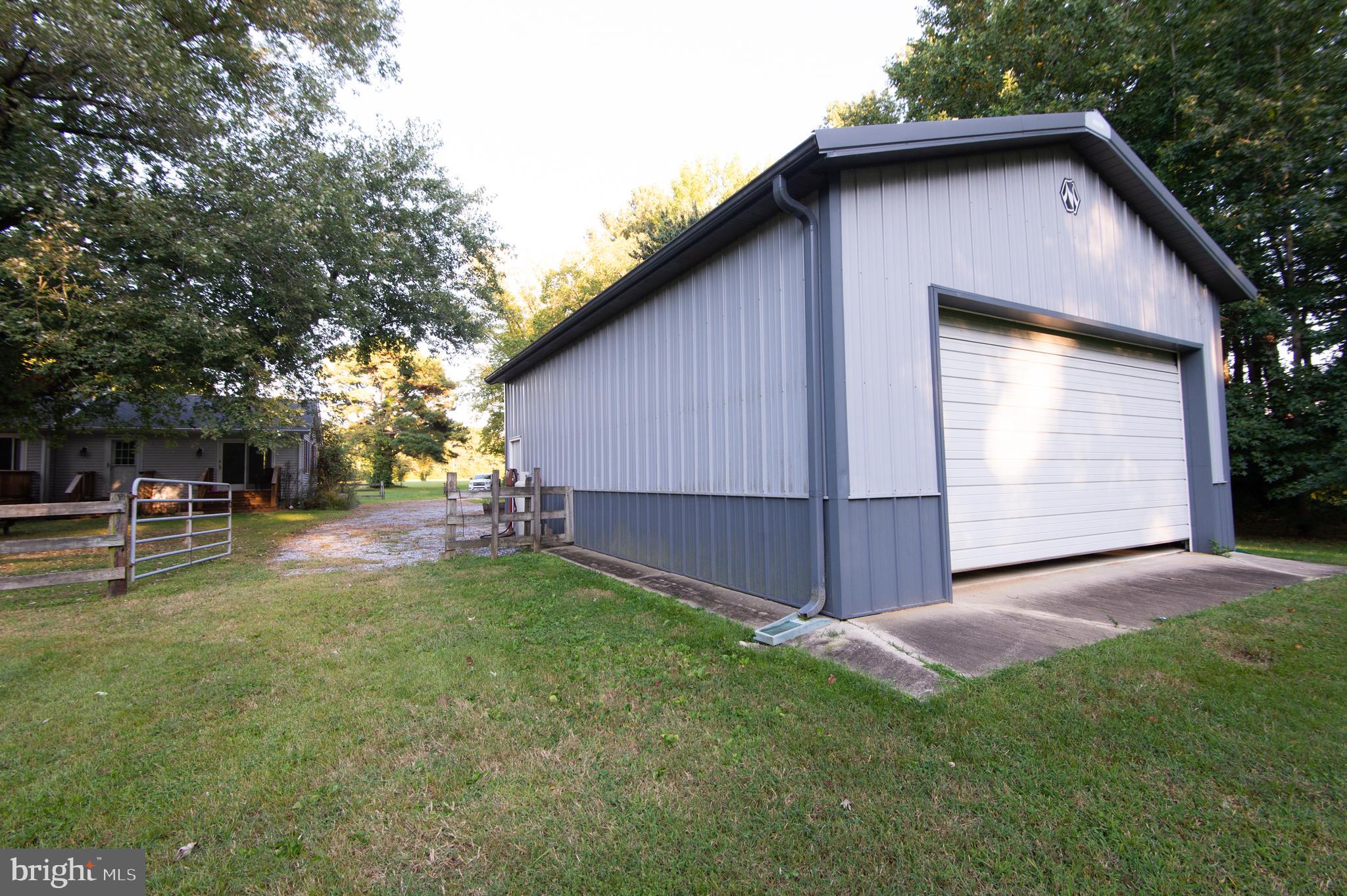 11482 Kittys Corner Road Cordova, MD 21625 - Photo 19 of 68 a backyard of a house with table and chairs