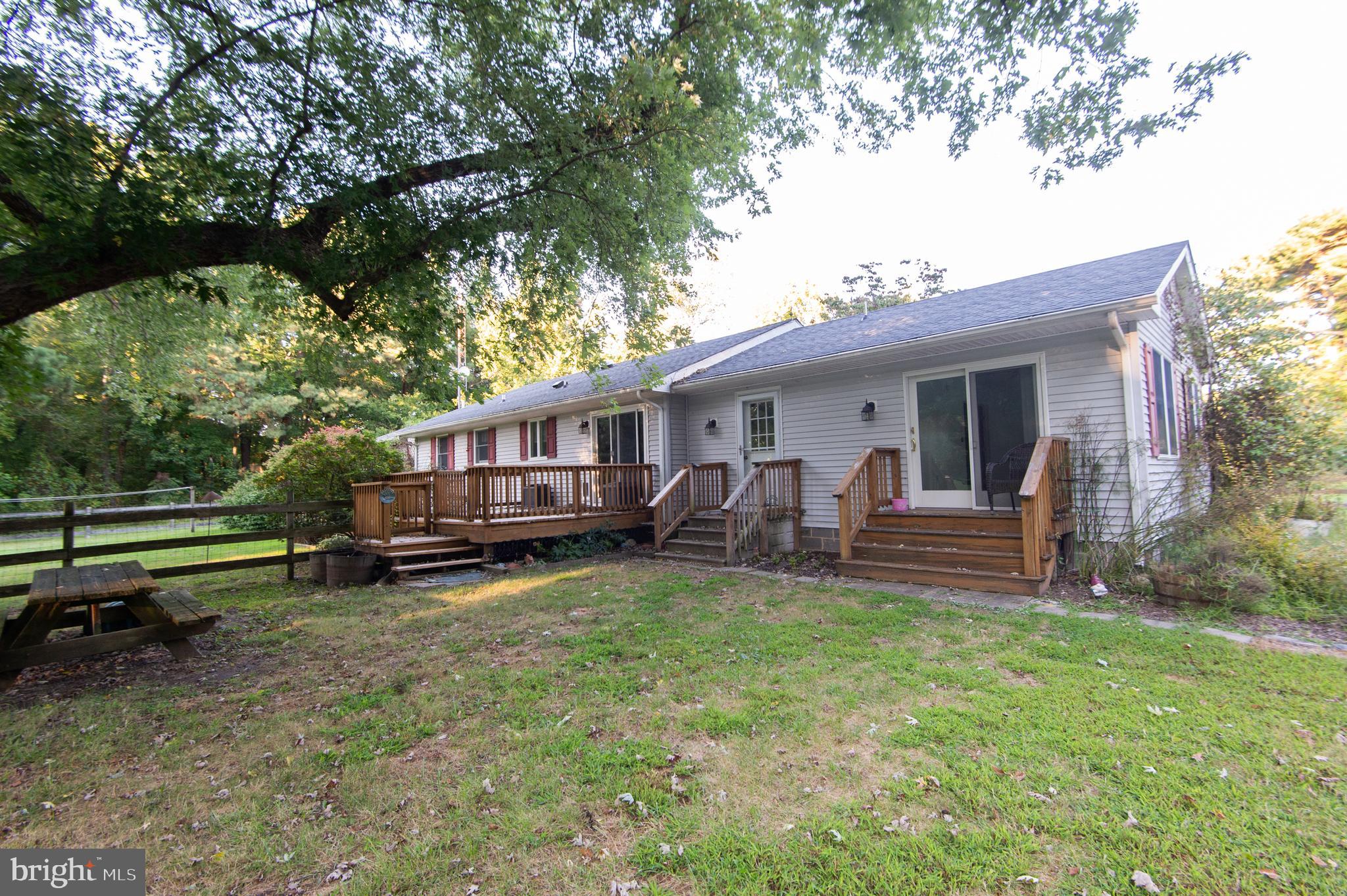 11482 Kittys Corner Road Cordova, MD 21625 - Photo 2 of 68 a view of a house with a yard porch and wooden fence