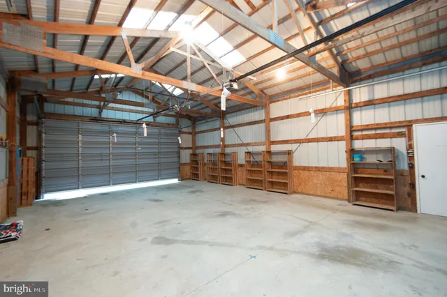 a view of an empty room with wooden roof