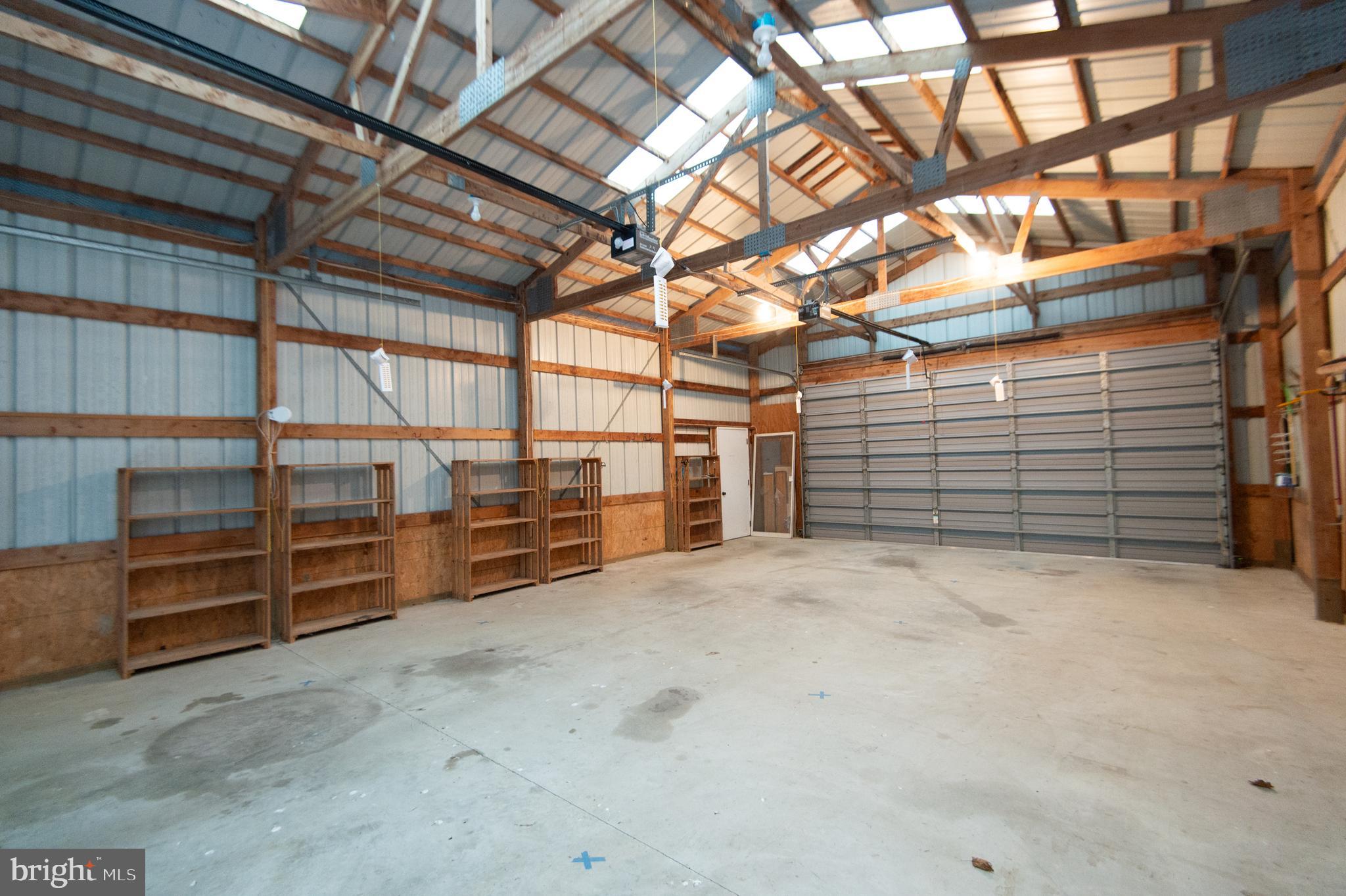 11482 Kittys Corner Road Cordova, MD 21625 - Photo 22 of 68 a view of a garage room with stairs