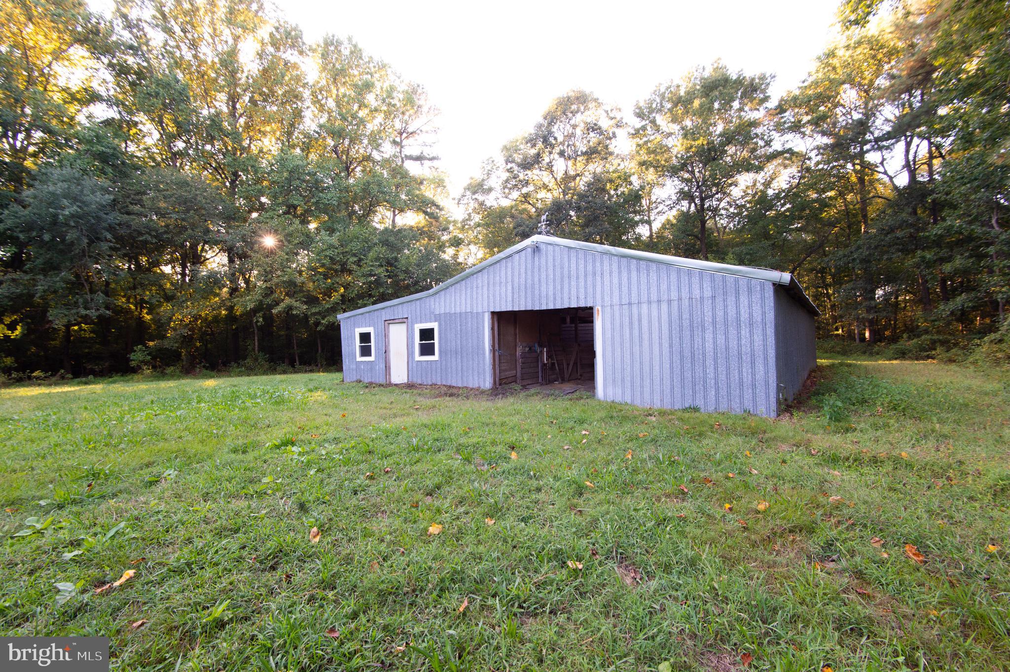 11482 Kittys Corner Road Cordova, MD 21625 - Photo 28 of 68 a view of a barn house with a yard