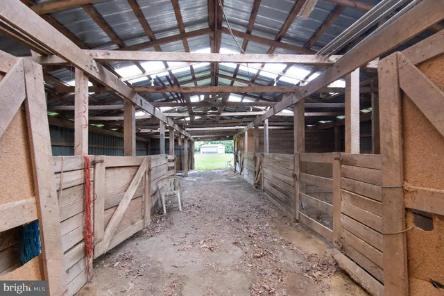 a kitchen with granite countertop a sink a stove and cabinets