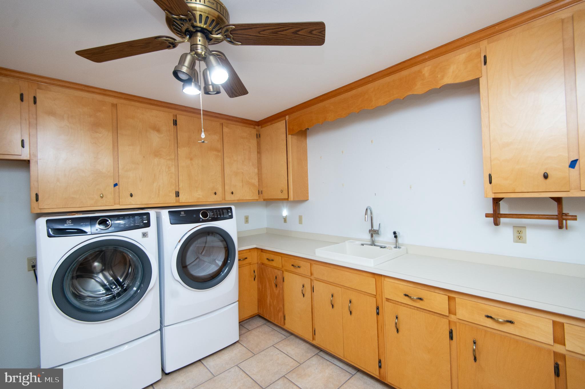 11482 Kittys Corner Road Cordova, MD 21625 - Photo 34 of 68 a utility room with sink dryer and washer
