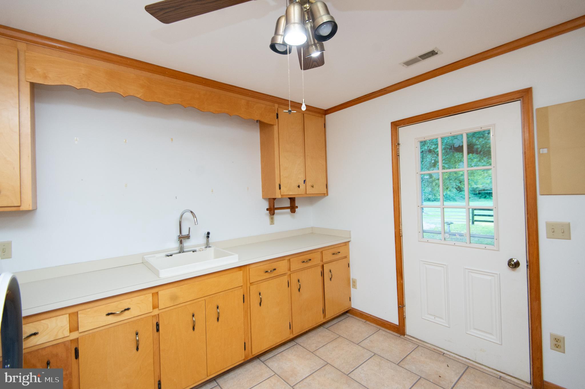 11482 Kittys Corner Road Cordova, MD 21625 - Photo 37 of 68 a bathroom with a sink a mirror and a shower