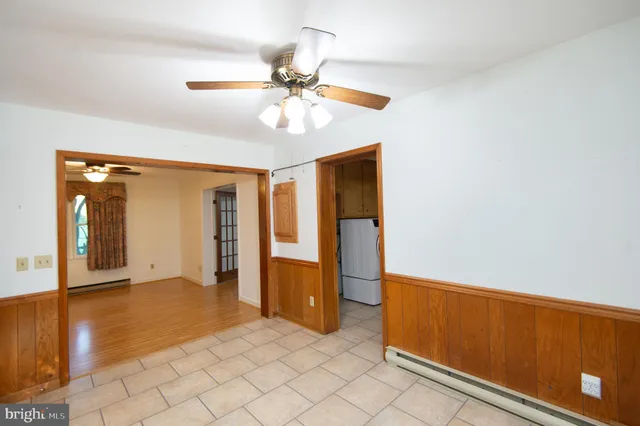 a bathroom with a sink vanity and a toilet