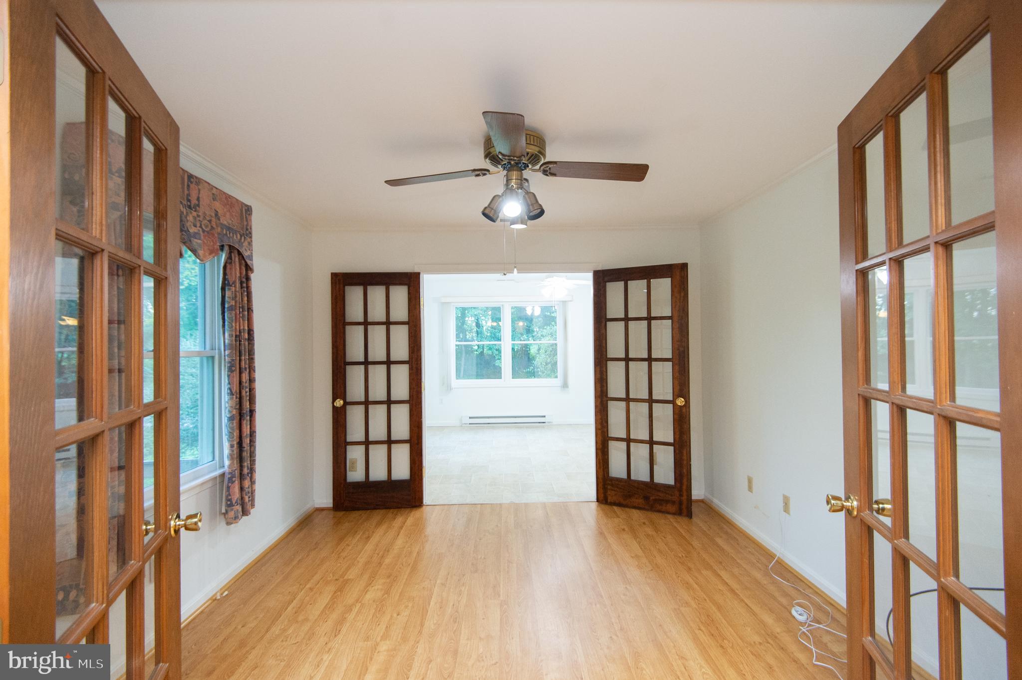 11482 Kittys Corner Road Cordova, MD 21625 - Photo 49 of 68 a view of an entryway with wooden floor and a ceiling fan