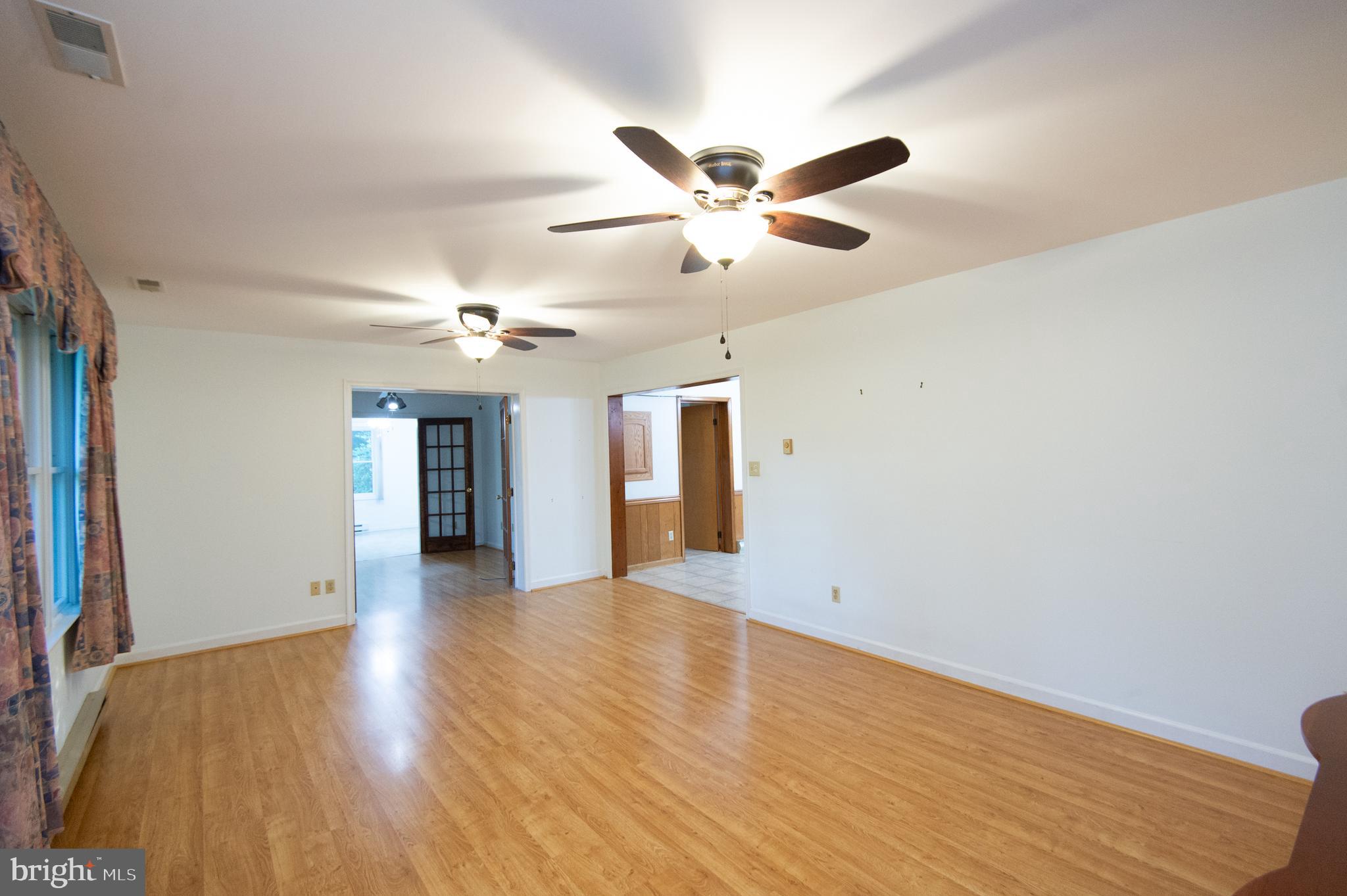 11482 Kittys Corner Road Cordova, MD 21625 - Photo 53 of 68 a view of an empty room with window and wooden floor