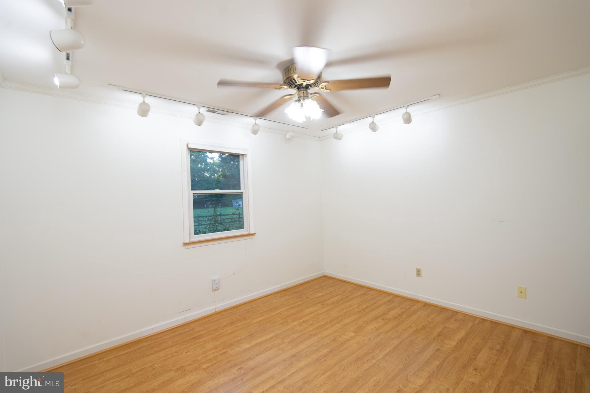 11482 Kittys Corner Road Cordova, MD 21625 - Photo 55 of 68 an empty room with a window and a fan