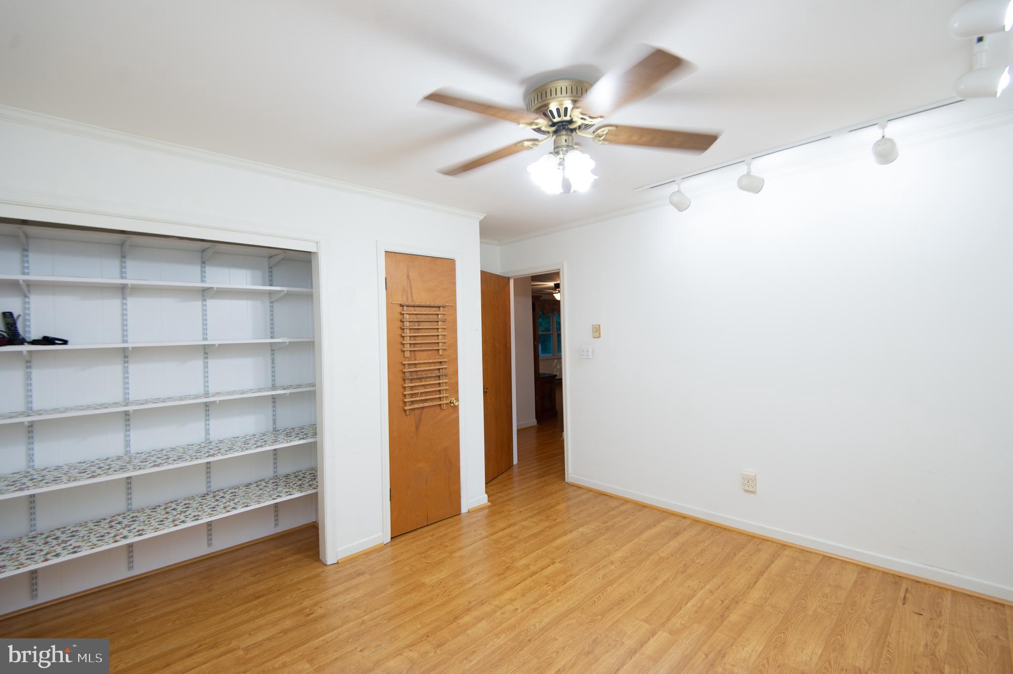11482 Kittys Corner Road Cordova, MD 21625 - Photo 57 of 68 a view of an empty room with a window and wooden floor