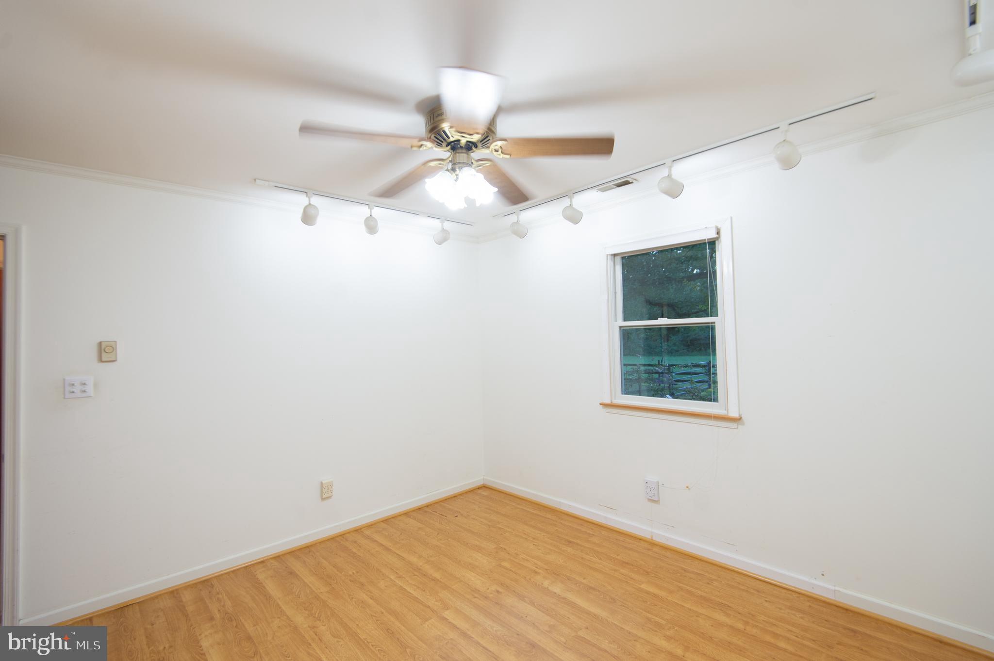 11482 Kittys Corner Road Cordova, MD 21625 - Photo 58 of 68 an empty room with a window and a fan