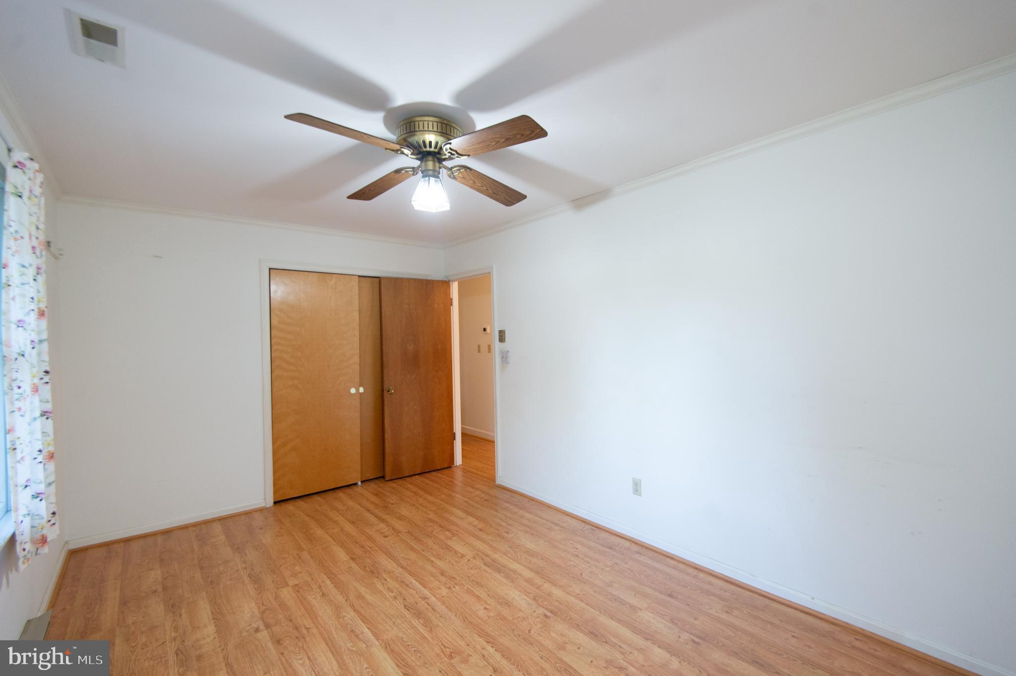 11482 Kittys Corner Road Cordova, MD 21625 - Photo 61 of 68 a view of a big room with wooden floor and windows in a room