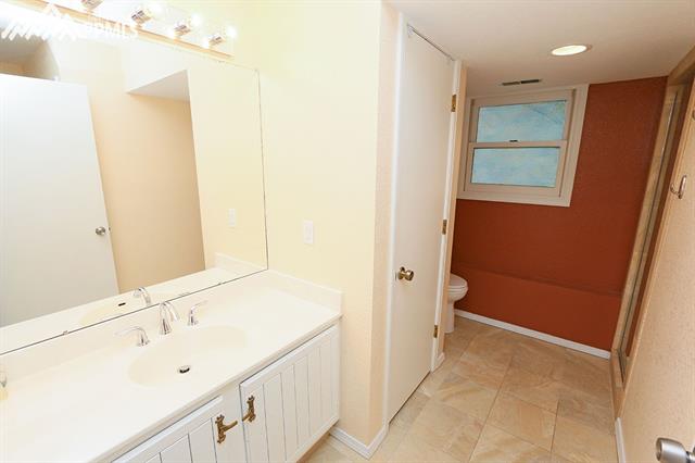 3123 Springdowns Place Colorado Springs, CO 80906 - Photo 23 of 36 Basement bathroom with newer tile on floor and in the updated shower. Handicap accessible doorway and ADA toilet. Also to the right there is a large original sauna.