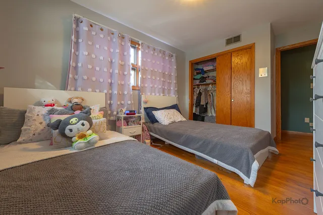 a bedroom with a bed and a couch