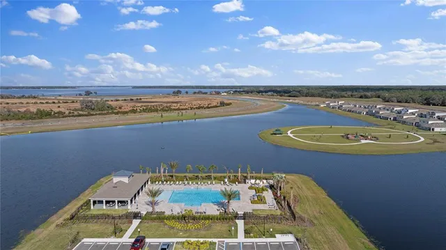 a view of a swimming pool with a lake view