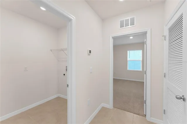 a view of hallway with windows