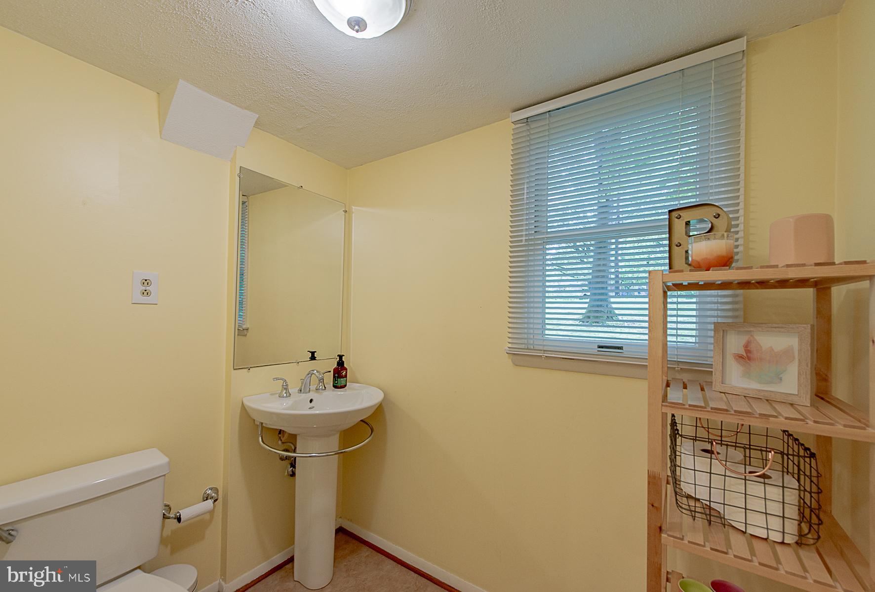 2617 Jonathan Road Ellicott City, MD 21042 - Photo 13 of 26 Convenient Family Room Level Powder Room