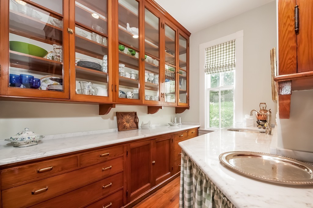 53 Tupelo Road Swampscott, MA 01907 - Photo 12 of 28 a bathroom with a granite countertop sink and a window