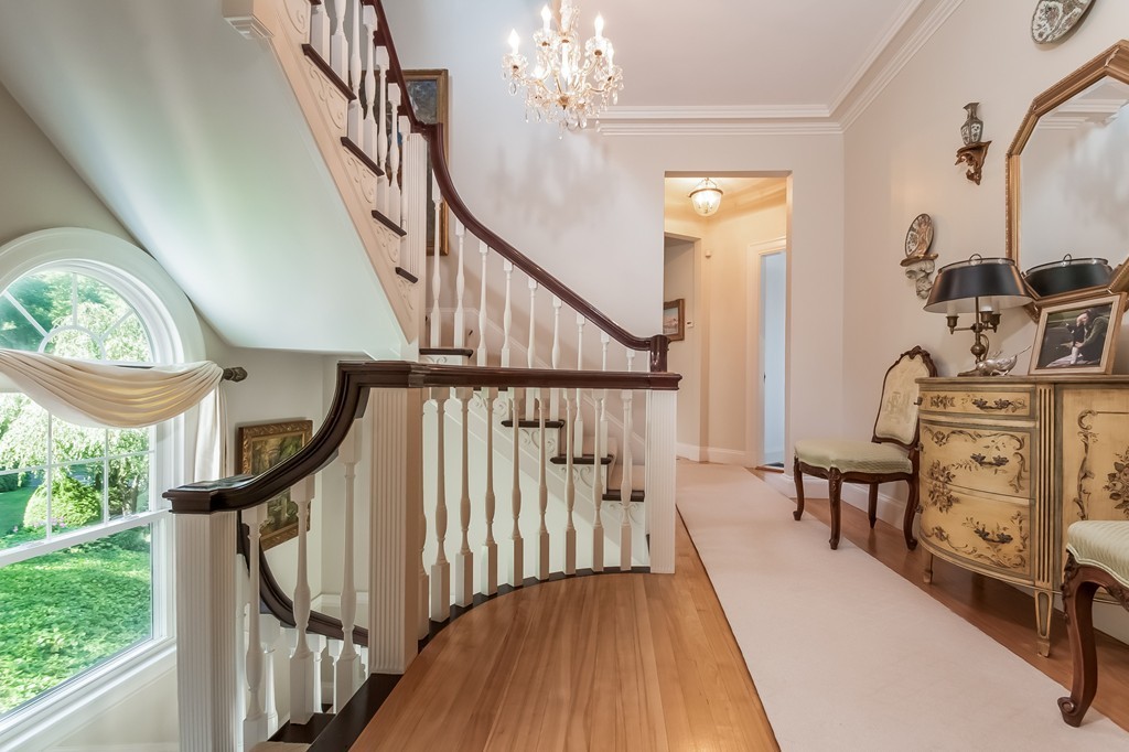 53 Tupelo Road Swampscott, MA 01907 - Photo 14 of 28 a view of a hallway with wooden floor windows and stairs