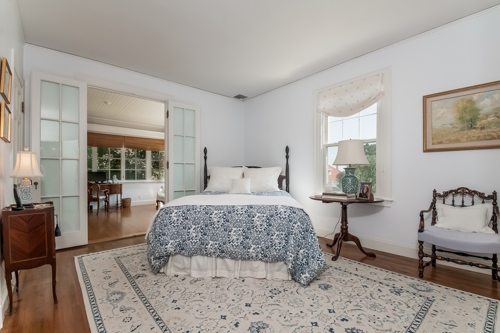 53 Tupelo Road Swampscott, MA 01907 - Photo 16 of 28 a bedroom with a bed and wooden floor