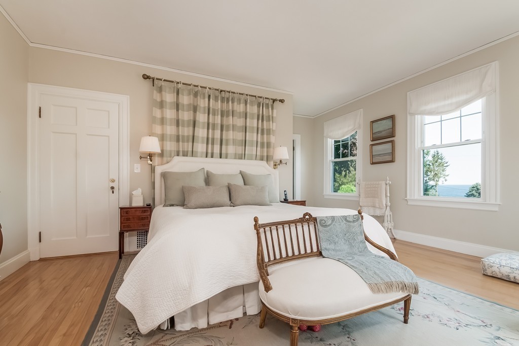 53 Tupelo Road Swampscott, MA 01907 - Photo 19 of 28 a bedroom with a bed and wooden floor