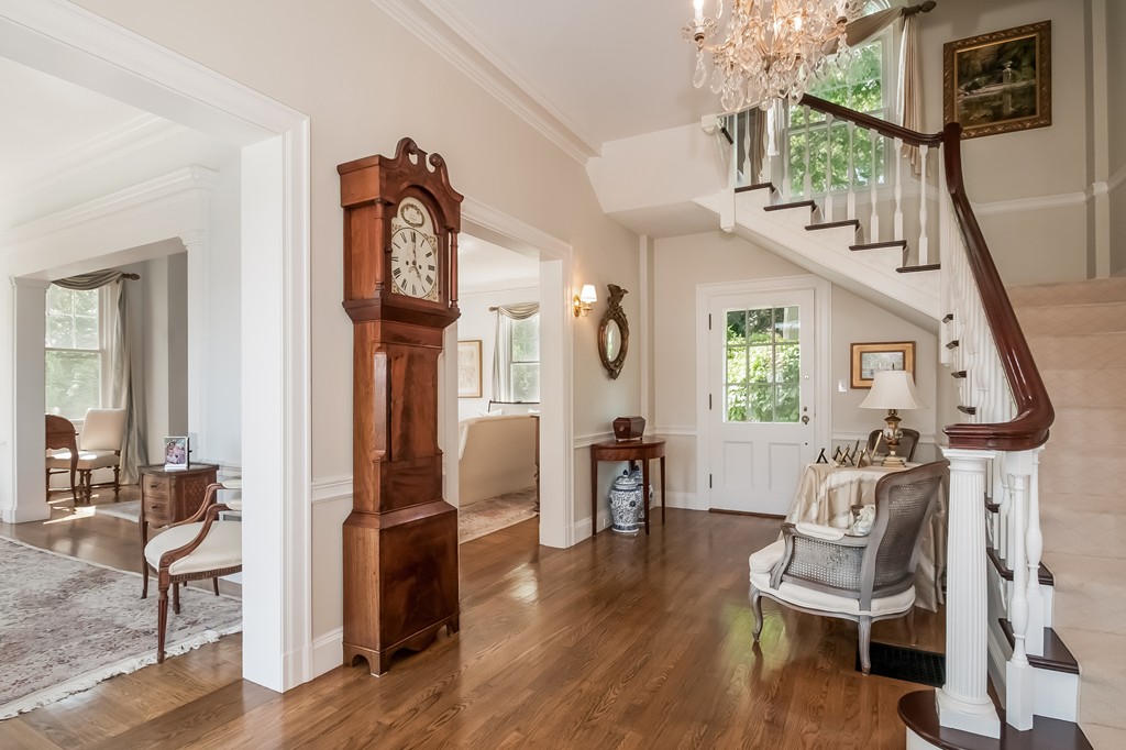 53 Tupelo Road Swampscott, MA 01907 - Photo 3 of 28 a view of a hallway with wooden floor and furniture