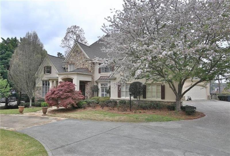 2737 Tarva Place Duluth, GA 30097 - Photo 2 of 33 a front view of a house with a yard