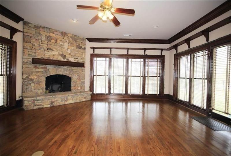 2737 Tarva Place Duluth, GA 30097 - Photo 22 of 33 a view of an empty room with wooden floor and a window