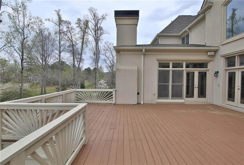 2737 Tarva Place Duluth, GA 30097 - Photo 23 of 33 a view of a roof deck with wooden floor and fence