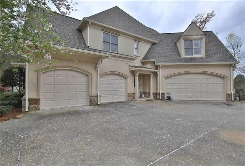 2737 Tarva Place Duluth, GA 30097 - Photo 24 of 33 front view of a house with a parking space