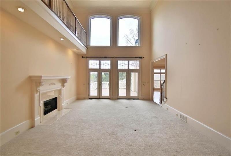 2737 Tarva Place Duluth, GA 30097 - Photo 31 of 33 a view of an empty room with a fireplace and a window