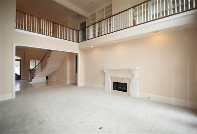 2737 Tarva Place Duluth, GA 30097 - Photo 32 of 33 a view of an empty room with a fireplace