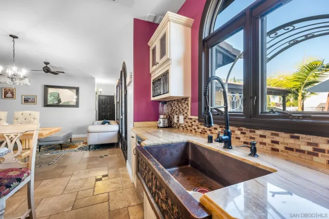 a en suite bathroom with sink and mirror