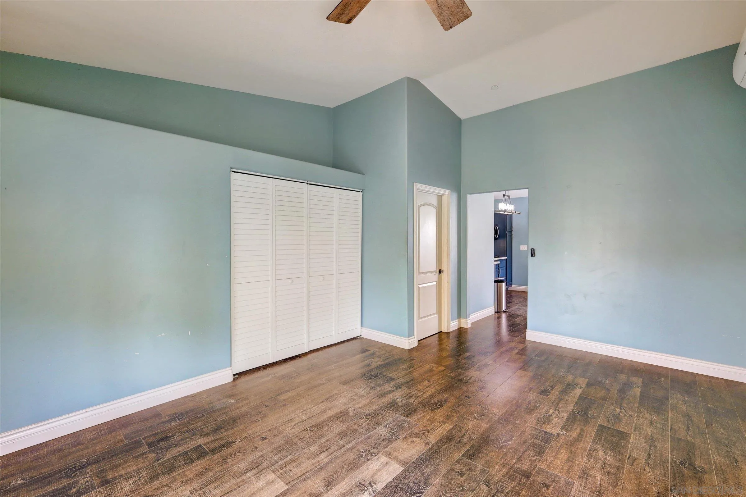 523 Hatherly Street Vista, CA 92083 - Photo 30 of 36 a view of an empty room with wooden floor
