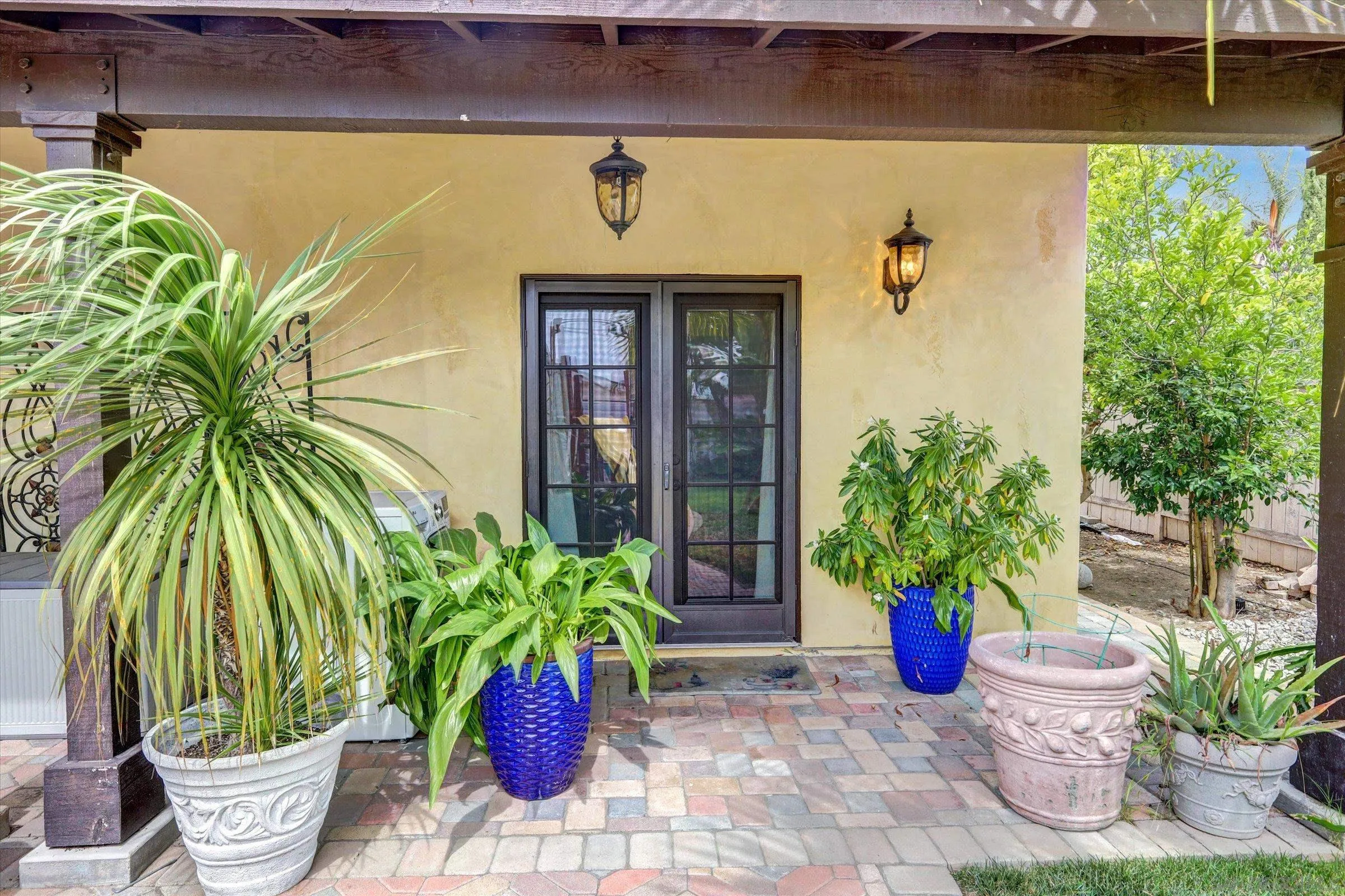 523 Hatherly Street Vista, CA 92083 - Photo 31 of 36 a potted plant sitting in front of a door