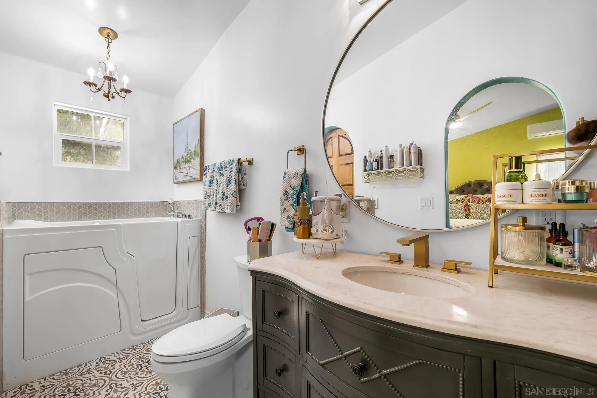 523 Hatherly Street Vista, CA 92083 - Photo 10 of 36 a bathroom with a sink a toilet and a mirror