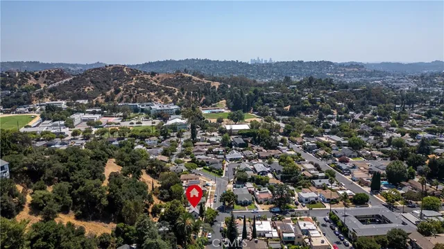 an aerial view of residential house with outdoor space