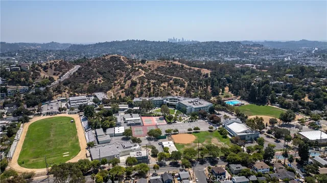 an aerial view of residential house and green space